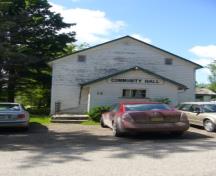 Of note are the low gable roof and the wooden frame exterior.; Kirsten Pries, 2008.