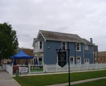 Of note is the vertical board and batten siding.; Kirsten Pries, 2008.