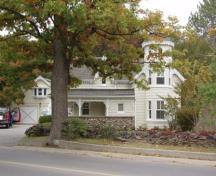 Of note is the gingerbread detailing found in all the gables and along the edges of the eaves.; Paul Dubniak, 2009.