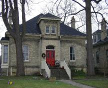 Of note is the symmetrical facade, including the central gable.; Emily Elliot, 2008.