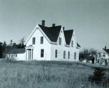 This undated image shows the ornate entrance located on the side of the building.; Grand Manan Historical Society