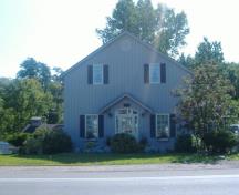 Of note is the clapboard exterior and gable roof.; Callie Hemsworth, 2008