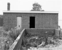 Former Stores Building 110 (Carpenter Shop and Smithy) Recognized Federal Heritage Building; (HRS, 1991.)