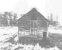 Side View of Livestock Shed, showing the varied sized lumber used for its construction, 1992.; Public Works Canada, Architectural & Engineering Services - Canadian Parks Services, Western Regional Offices/ Ministère des Travaux publics, Services d'architecture et de génie, Service canadien des parcs, Bureau de la région de l'Ouest, 1992.