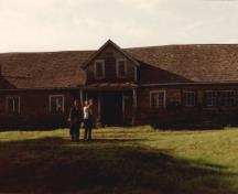 View of Building 100, showing the very long, rectangular massing with a gabled roof.; Agence Parcs Canada / Parks Canada Agency