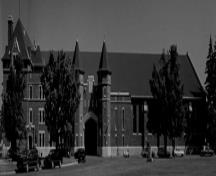 Front view of the Salaberry Armoury, showing the building’s two and three storey massing, the stepped profile, monumental scale and proportions, 1898.; Parks Canada Agency / Agence Parcs Canada, Henri Langlois, 1989.