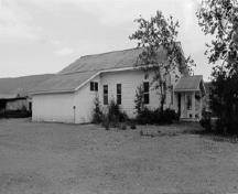View of the exterior of the Gold Room, showing its residential character despite its key industrial function, 1988.; Parks Canada Agency / Agence Parcs Canada, 1988.
