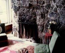 General view of the Cottage, showing the fieldstone chimney, 1989.; Parks Canada Agency / Agence Parcs Canada, S. Lunn, 1989.