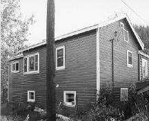 View of the Staff House, showing its two-storey wood-frame addition, 1988.; Agence Parcs Canada / Parks Canada Agency, 1988.