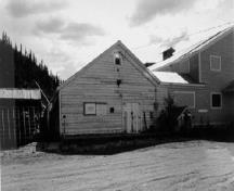 View of Warehouse No. 1, showing its comfortable relationship with the other structures and landscape features of the site, 1988.; Agence Parcs Canada / Parks Canada Agency, 1988.