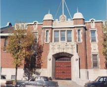 View of the entrance of the Armoury, showing its twin-towered frontispiece, 1989.; Ministère de la Défense nationale / Department of National Defence, 1989.