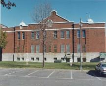 View of the Amoury, showing its two-storey massing, symmetry, and proportions, 1989.; Ministère de la Défense nationale / Department of National Defence, 1989.