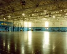 Interior view of Building 21, showing its large, open, central space, 1996.; Parks Canada Agency / Agence Parcs Canada, 1996.