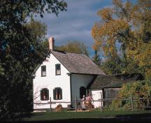 General view showing the house with its rectangular footprint and one-and-a-half-storey massing.; Parks Canada Agency / Agence Parcs Canada