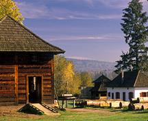 General view of the Fort Langley National Historic Site of Canada showing viewplanes from the palisades to the Fraser River and McMillan Island, to the east, looking upriver towards the site of the earlier fort, and to the countryside and west, 1988.; Parks Canada Agency / Agence Parcs Canada, A. Cornellier, 1988.