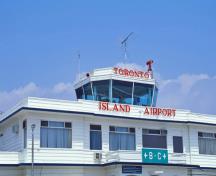 General view of Toronto Island Airport Terminal Building showing its central projecting control tower, including its placement and massing.; Parks Canada Agency / Agence Parcs Canada.