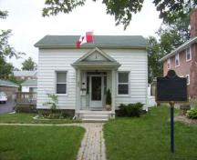 Front facade of home featuring a portico with pediment; Thorold's LACAC