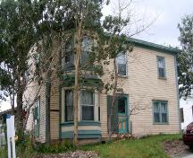 View of the left and front facades of John William Caines House, Norris Point, NL.; © HFNL 2010