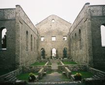 Interior of St. Raphael's Church Ruins showing walls of the nave, transepts and foundation, 2004.; OHT, 2004