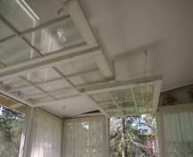 Porch window opening inwards, Davidson-Wigg Cottage, Gimli 2013; Historic Resources Branch, Manitoba Tourism, Culture, Heritage, Sport and Consumer Protection, 2014