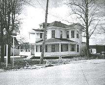 Historic image showing the building much the same as today; Village of Saint-Quentin