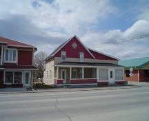 View of the front facade facing Canada Street.; Village of Saint-Quentin