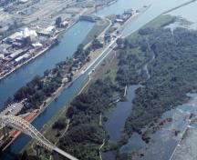 Aerial view showing the Whitefish Island National Historic Site of Canada on the right, 2001.; Agence Parcs Canada / Parks Canada Agency, G. Vandervlugt, 2001.