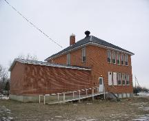 View of the 1927 rear addition (version of front façade) and 1960 addition, 2003.; Government of Saskatchewan, Jennifer Bisson, 2003.