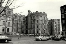 Rear view of the Victoria Museum, showing its crenellated silhouette, 1986.; Agence Parcs Canada / Parks Canada Agency, 1986.
