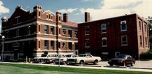General view of the A Block, showing the white stone detailing, 1986.; Royal Canadian Mounted Police \ Gendarmerie royale du Canada, 1986.