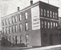 L’édifice Times avec la brique exposée.; Moncton Museum