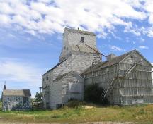 View northeast showing the elevator, annex and office, 2004.; Government of Saskatchewan, Marvin Thomas, 2004.